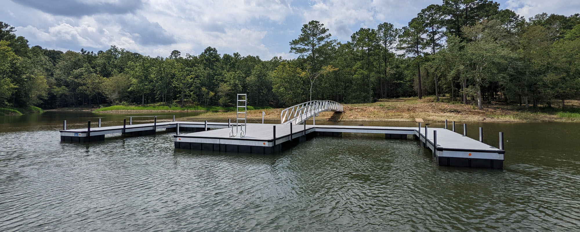 Custom Dock Systems is a full-service marine contractor that offers  custom-built aluminum and steel docks, custom boat lifts, commercial  marinas and multi-slip docks, dock repair and restoration, dock relcation, dock  accessories and